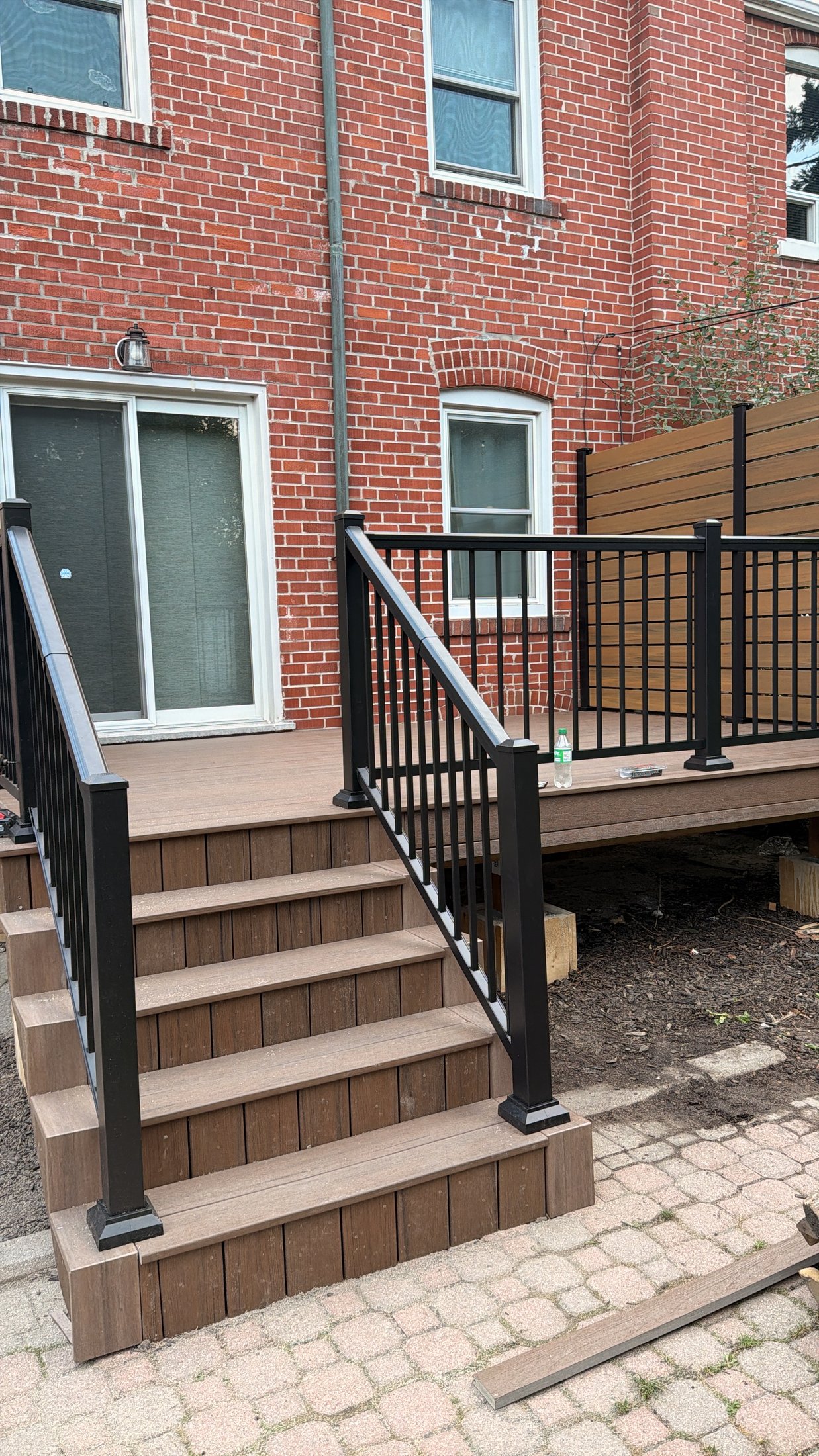 Dark Roast Composite Deck with Privacy Fence — photo 8