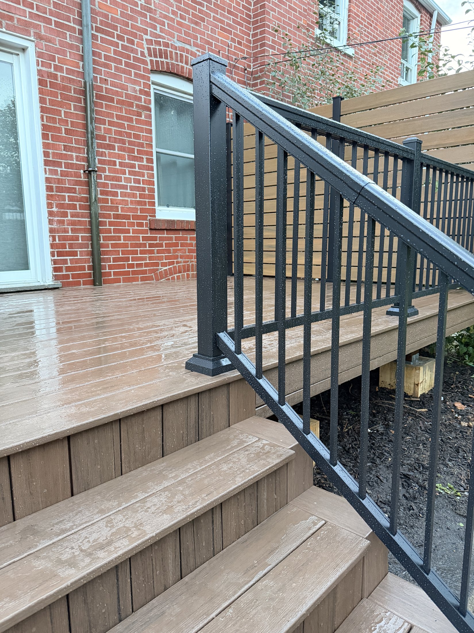 Dark Roast Composite Deck with Privacy Fence — photo 5
