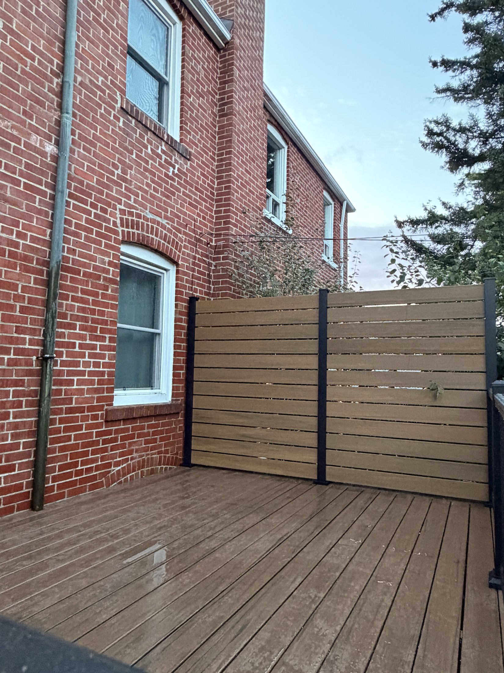 Dark Roast Composite Deck with Privacy Fence — photo 4