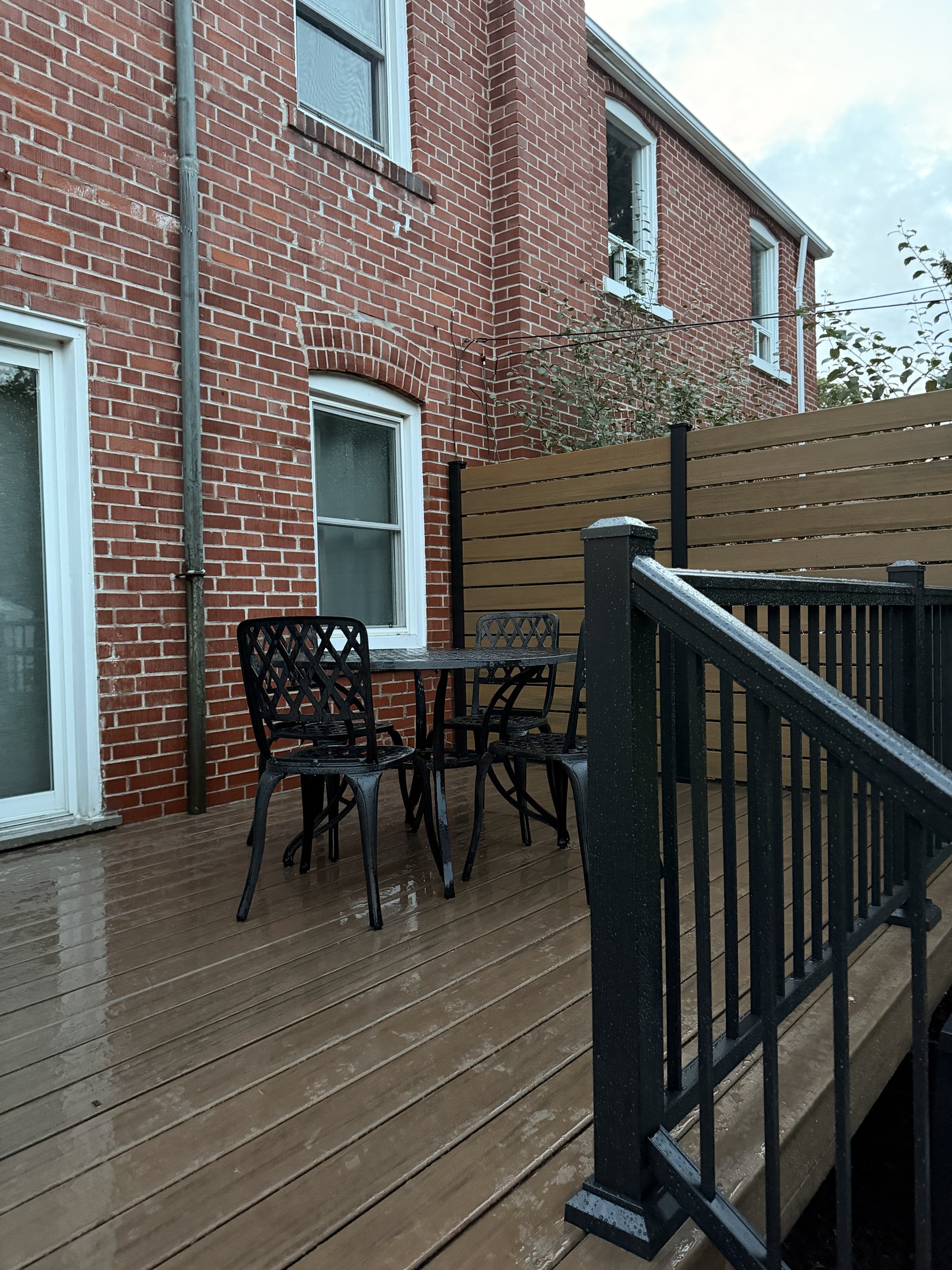 Dark Roast Composite Deck with Privacy Fence — photo 9